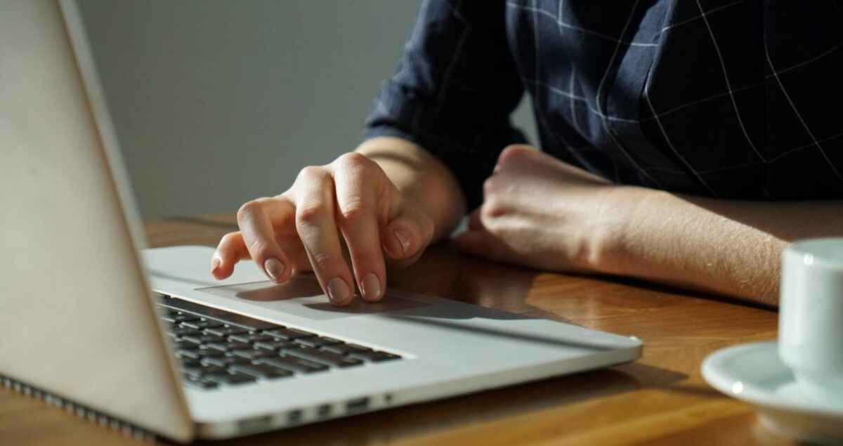 person typing on a laptop