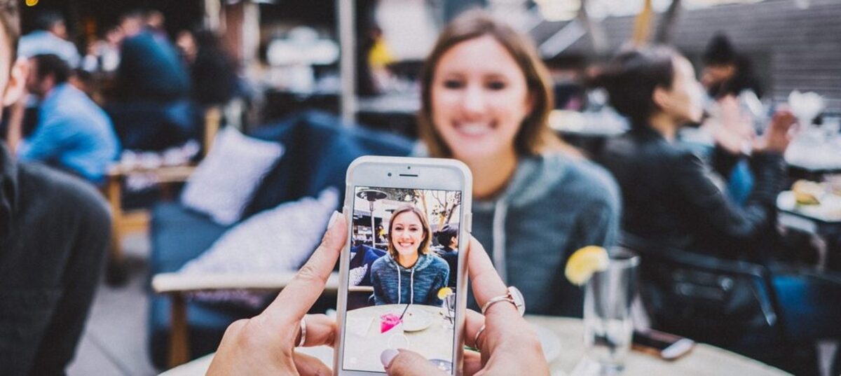 Image of person taking a photo