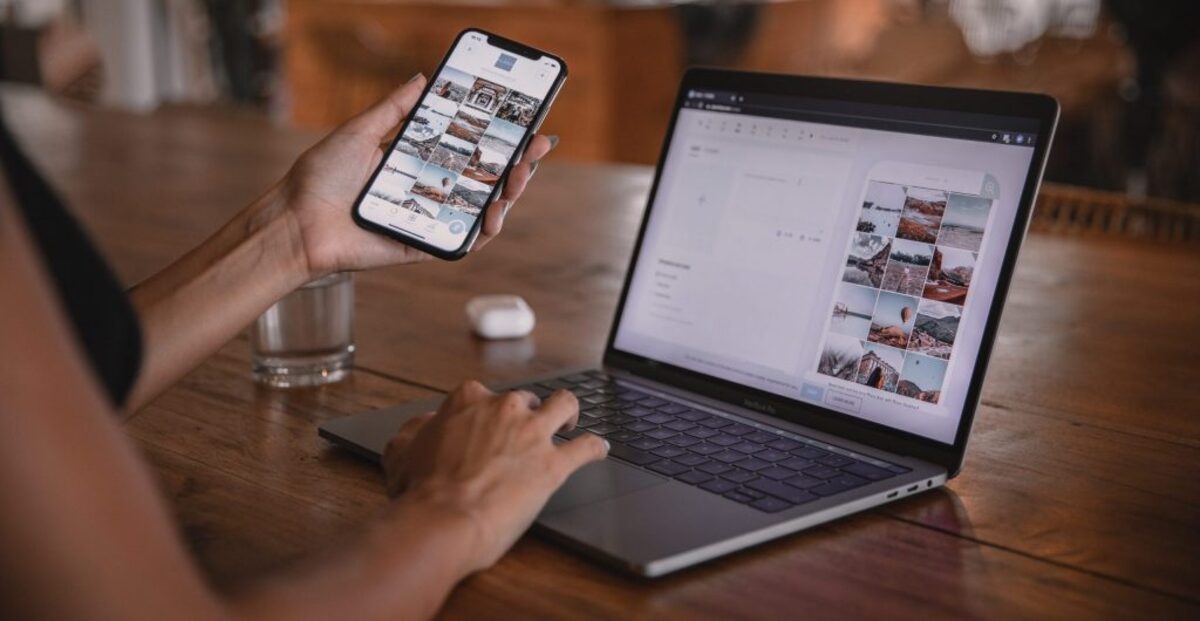 Woman using smartphone and laptop