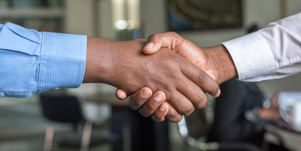 two people shaking hands