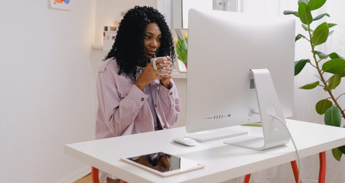 Woman Sipping Tea Working