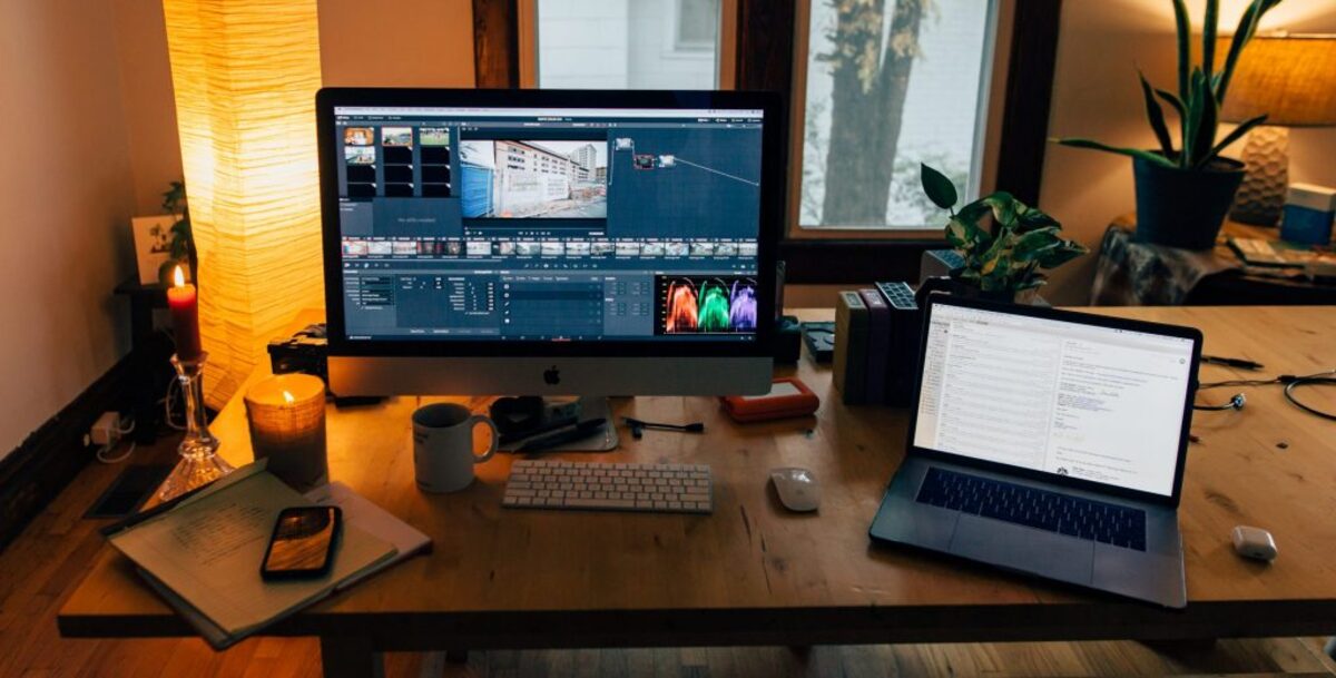 Modern workplace with gadgets in cozy room with soft light