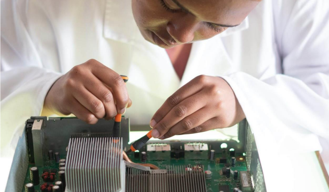 Woman Working on a motherboard
