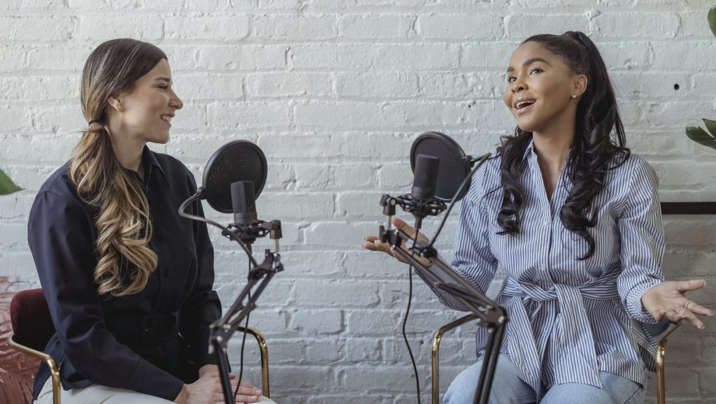 Positive black woman talking to radio host