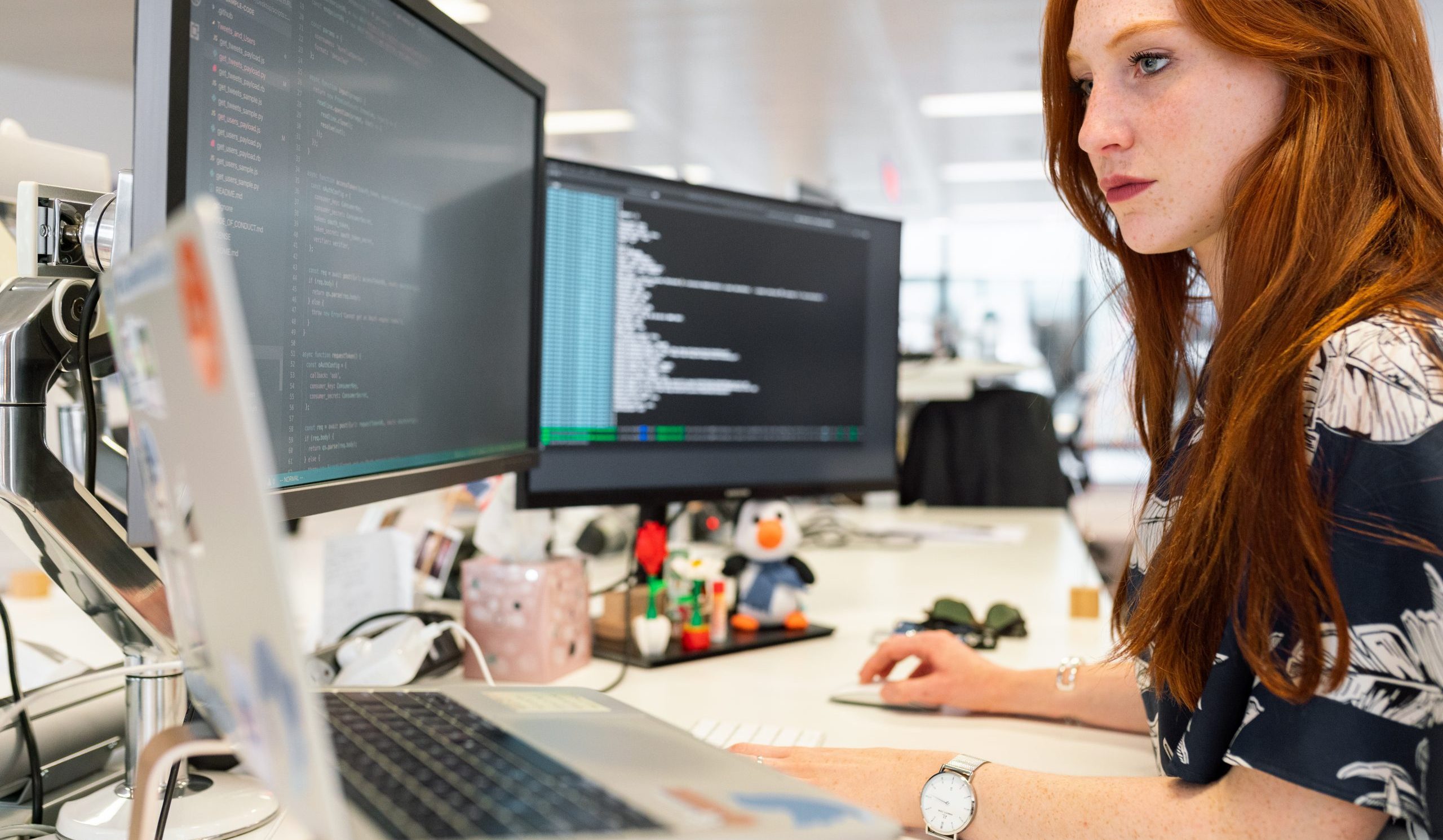 Woman coding on computer