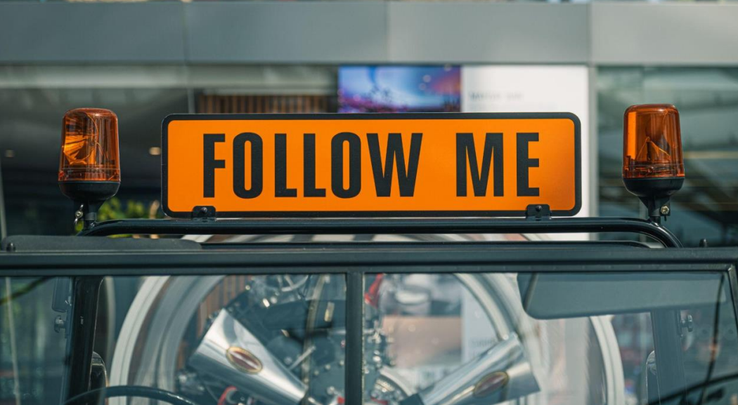 Follow me sign