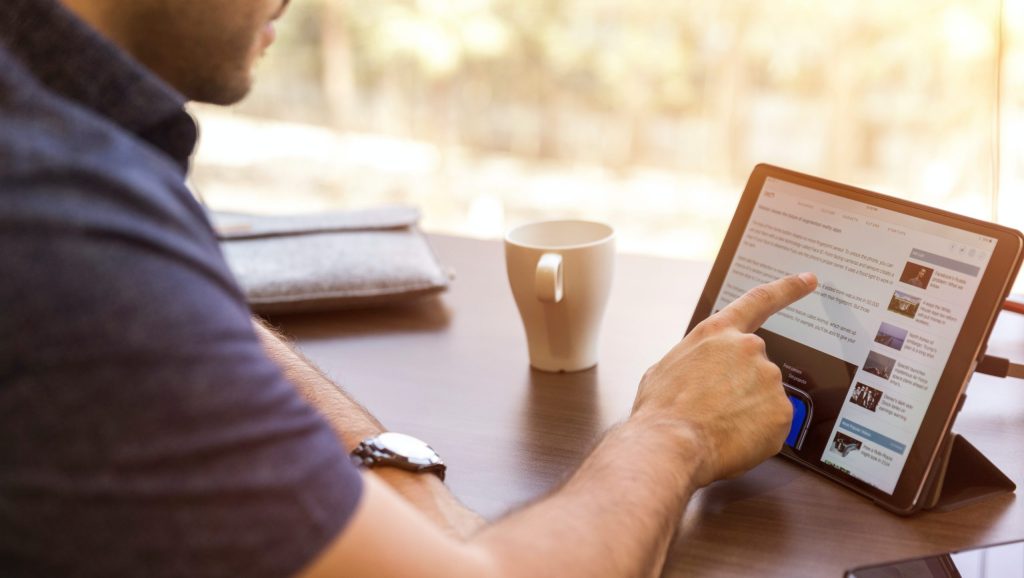 man holding tablet computer